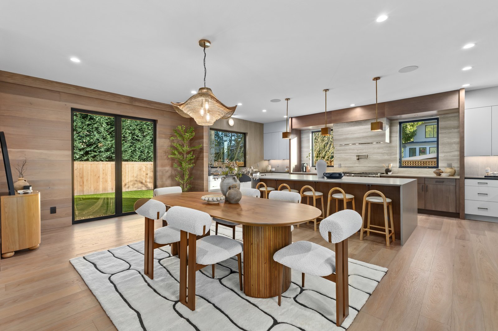 Venice FL warm modern two-tone kitchen with walnut cabinets and white quartz by The Kitchen Depot