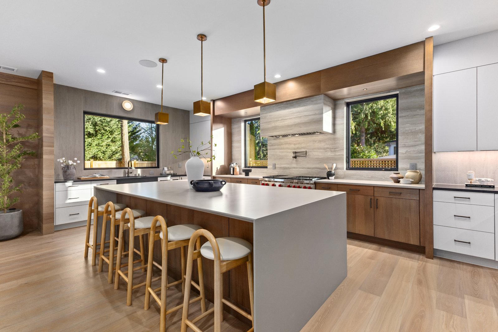 Venice FL warm modern kitchen island with quartz countertops by The Kitchen Depot