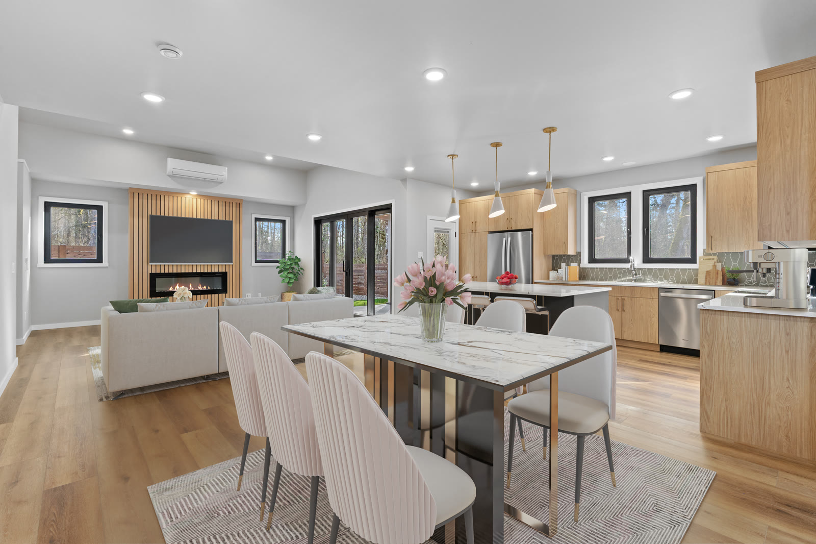 Light wood two-tone kitchen and dining room open-concept layout