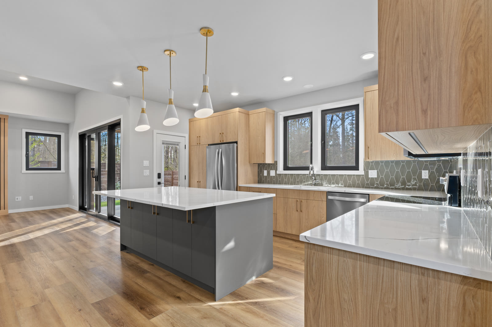 Light wood kitchen cabinets with gray island view