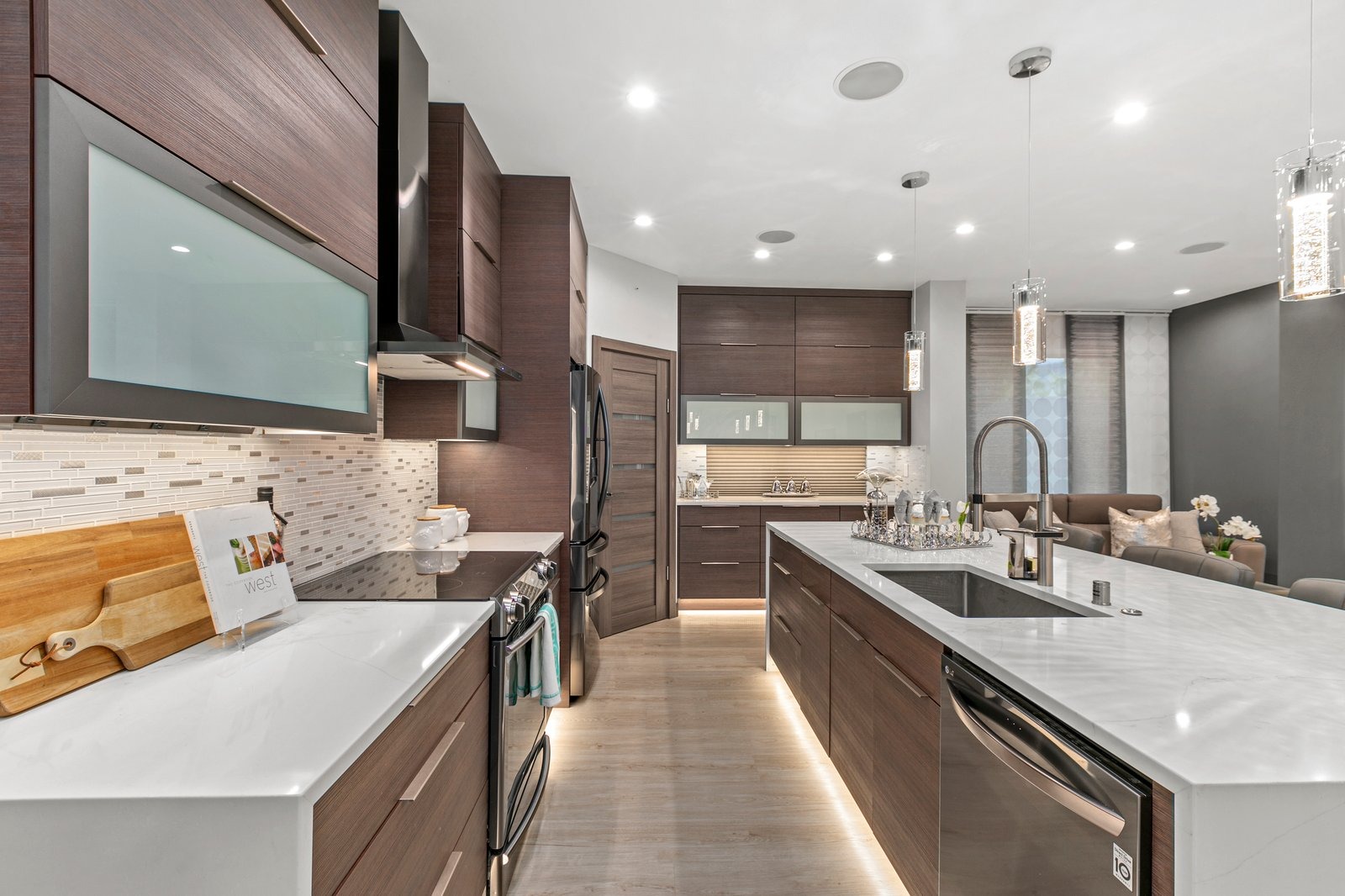 Dark wood kitchen cabinets Englewood FL — quartz island